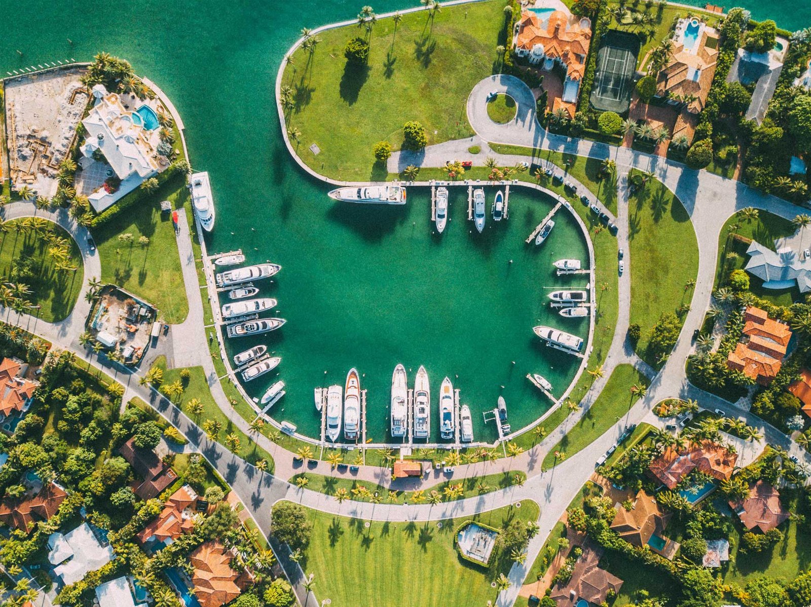 Aerial of the Bal Harbour yacht basin ringed by waterfront homes