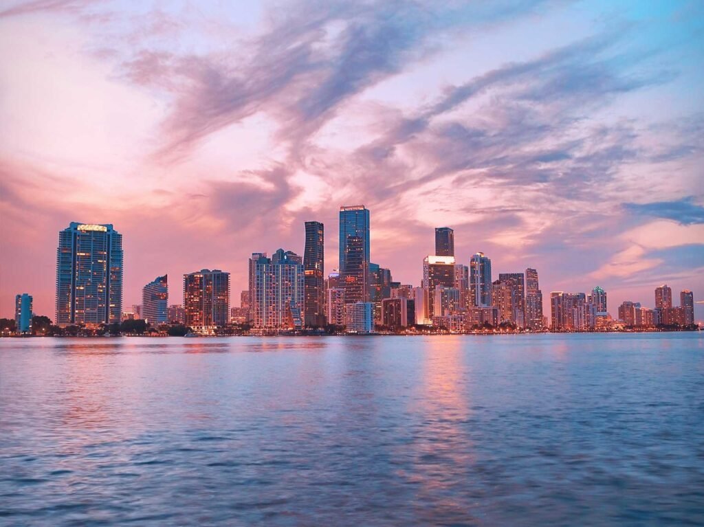 - Brickell House Brickell skyline at dusk seen across Biscayne Bay