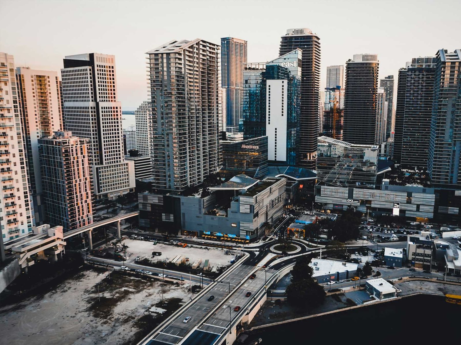 - Brickell Condos Aerial over the Brickell core showing towers, elevated transit and street grid
