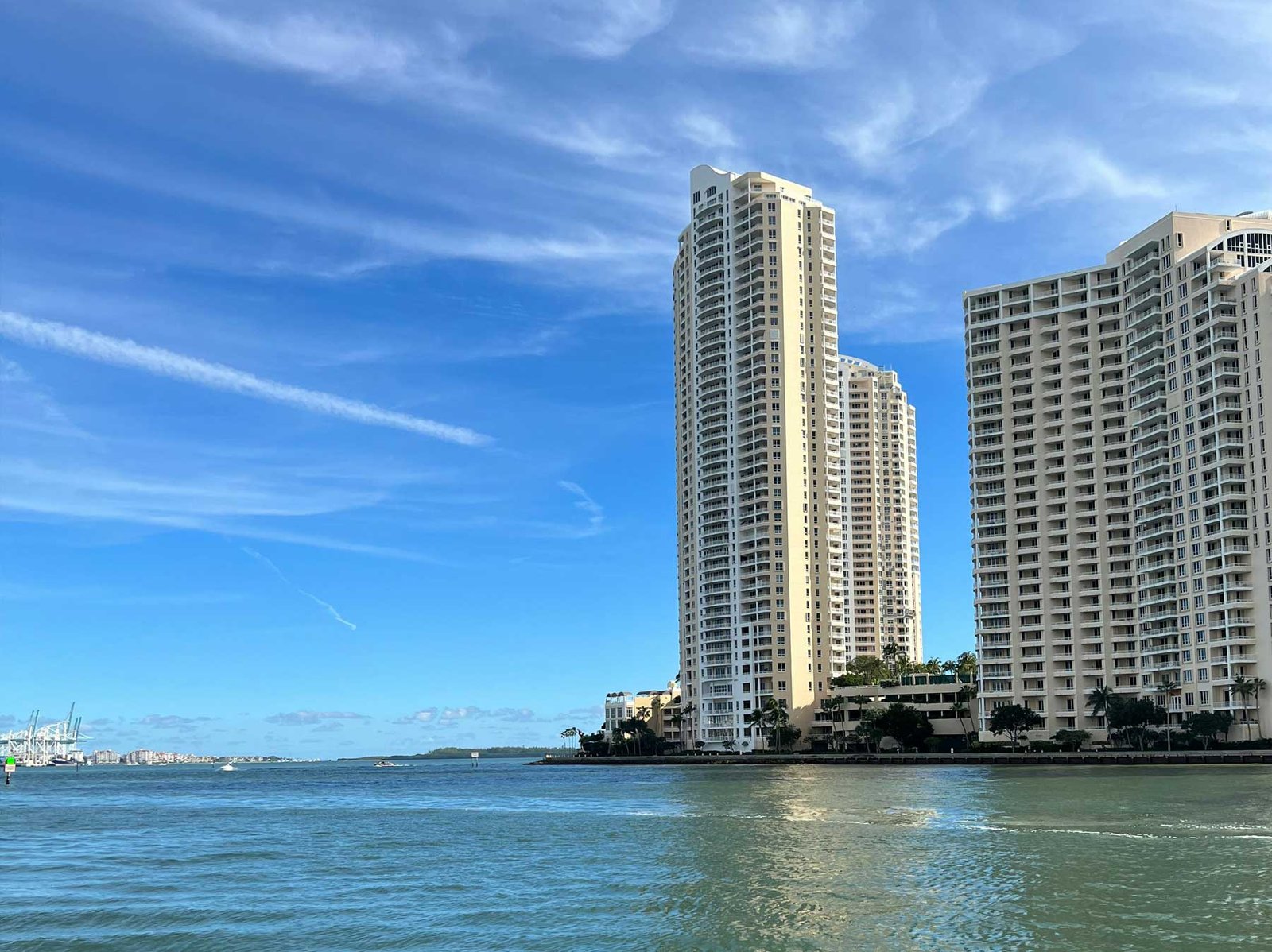 Brickell Key at dusk with the Miami skyline behind