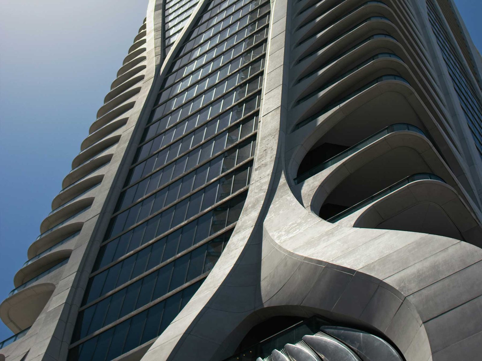 Close view of the white exoskeleton facade of One Thousand Museum in downtown Miami