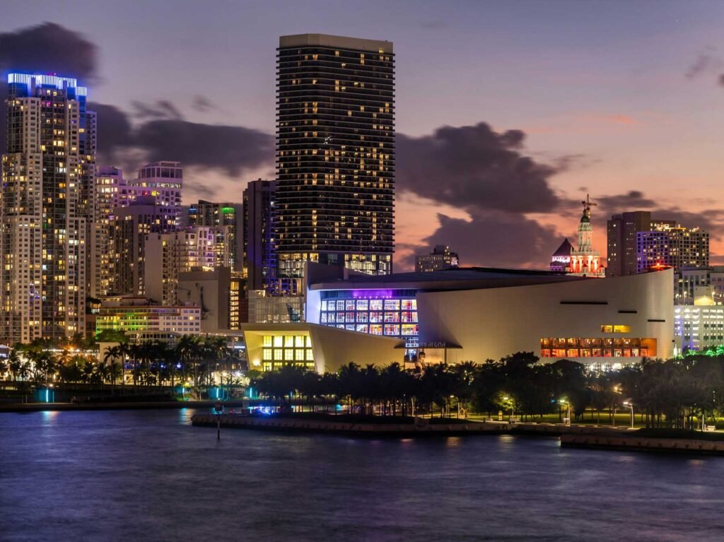 - $10 MILLION + Downtown Miami arena and skyline lit at night