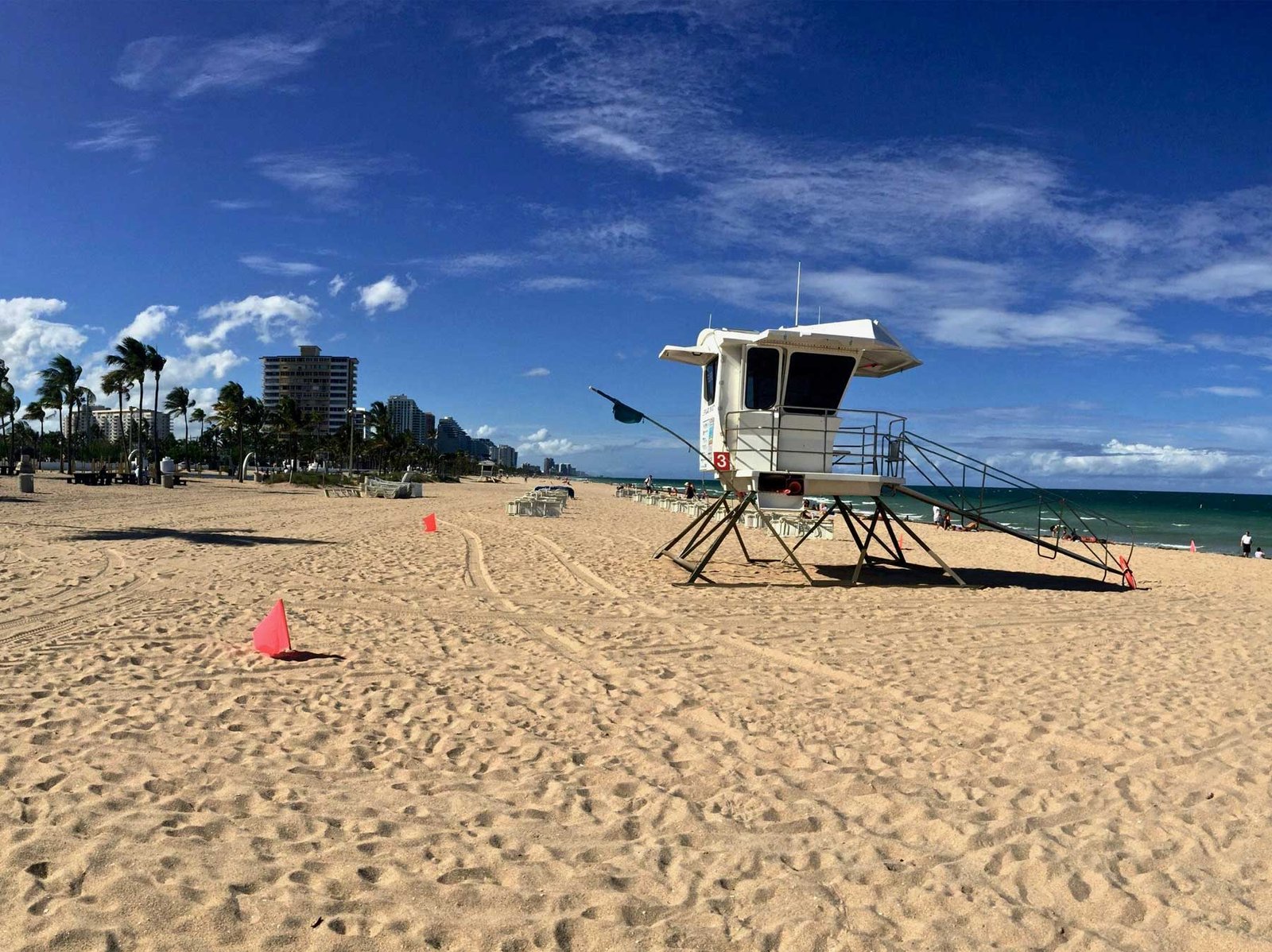 A lifeguard tower on Fort Lauderdale beach with the buildings of A1A behind