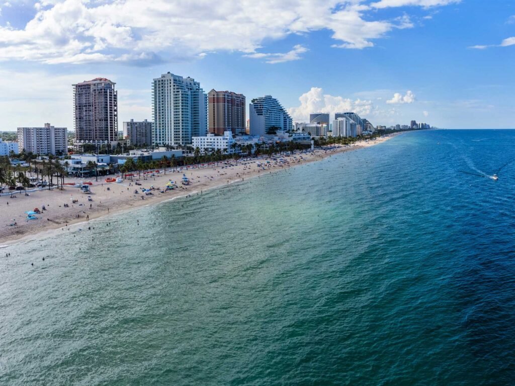 Aerial of the Fort Lauderdale beachfront, the tower line following the sand