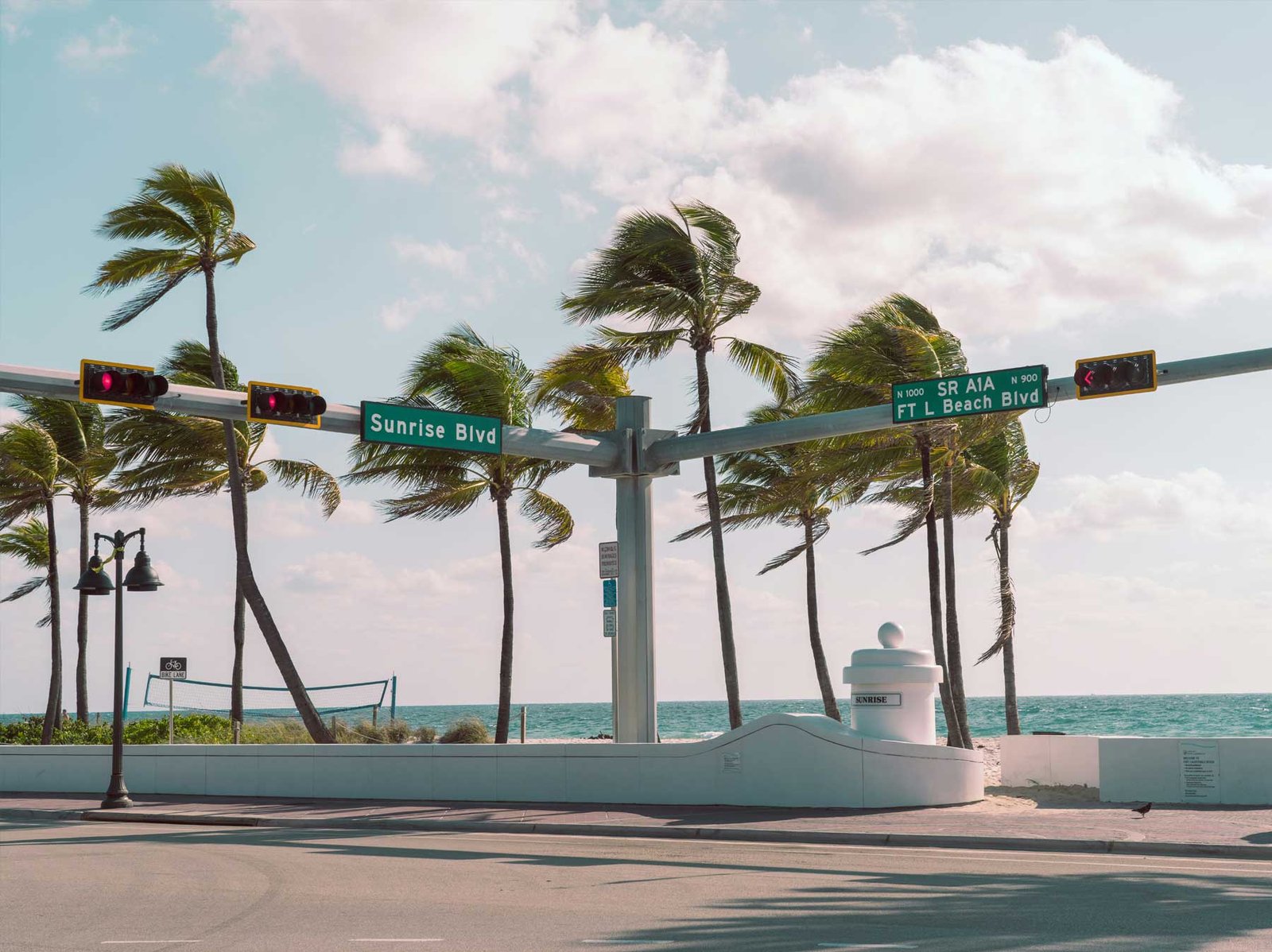 A street corner near the beach, palms bending in the wind, Fort Lauderdale