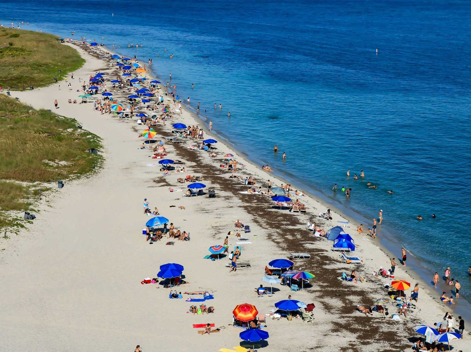 - Key Biscayne Beach with umbrellas and turquoise water on Key Biscayne