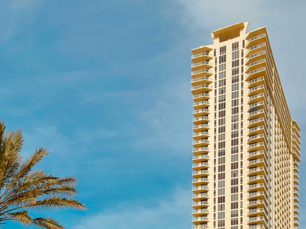 Oceanfront residential tower against a clear sky in Miami Beach