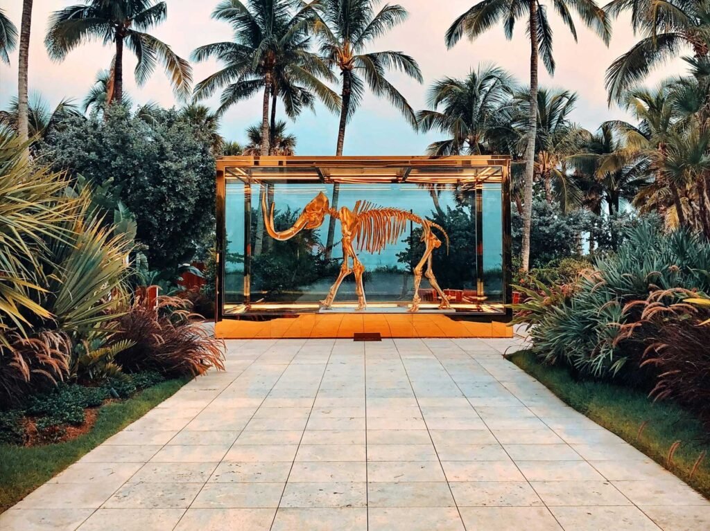 Sculpture installation framed by palms in the Faena District, Miami Beach