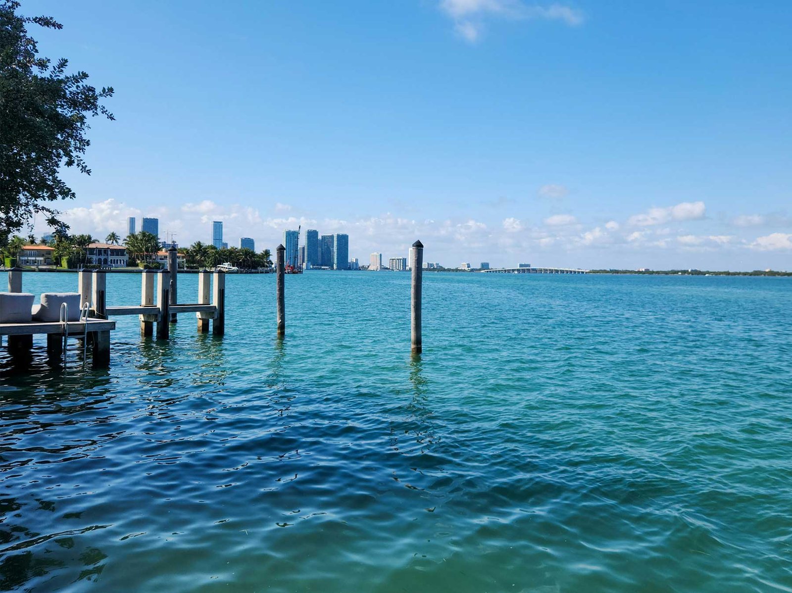 - Miami Waterfront Homes Miami waterfront home at dusk with boat lift