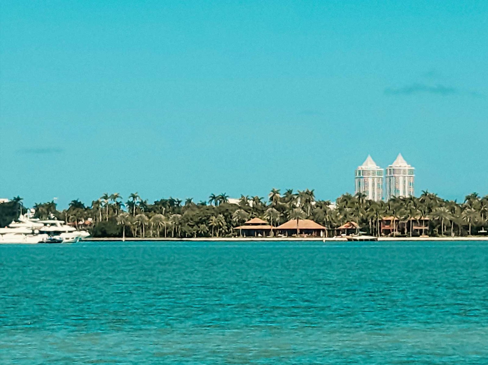 A private residential island of waterfront homes seen across turquoise water
