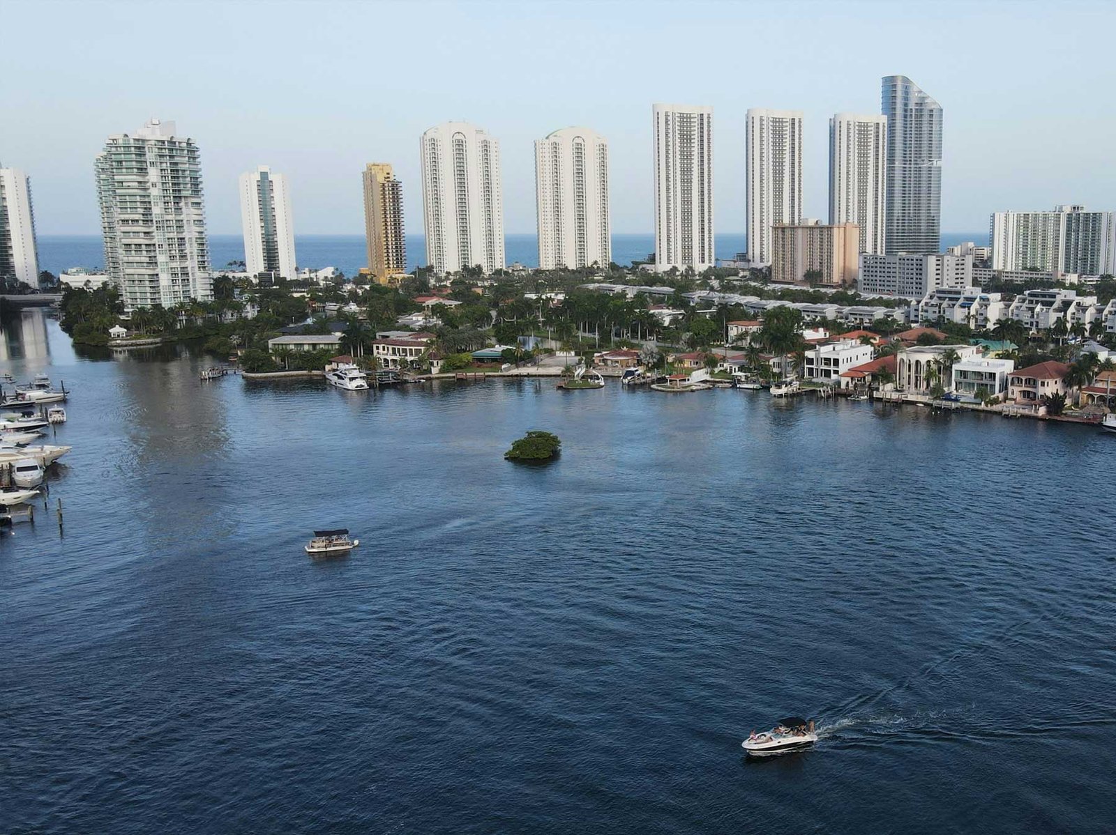 An intracoastal waterway with the Sunny Isles Beach tower row behind