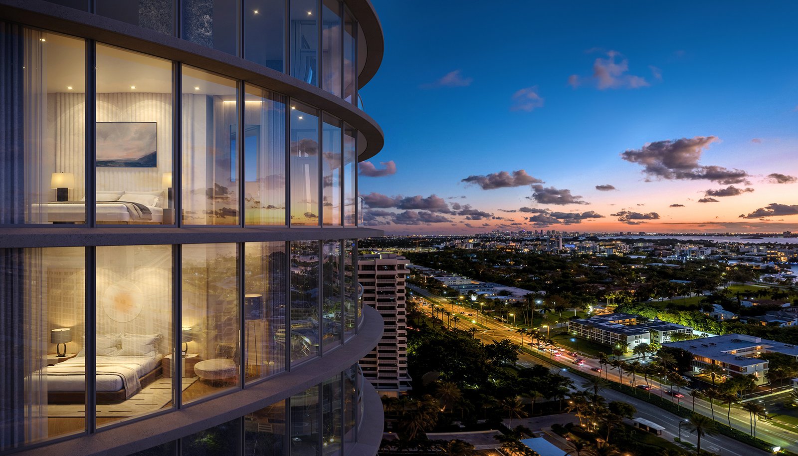 Rivage Bal Harbour facade at dusk with residences lit from within — developer rendering