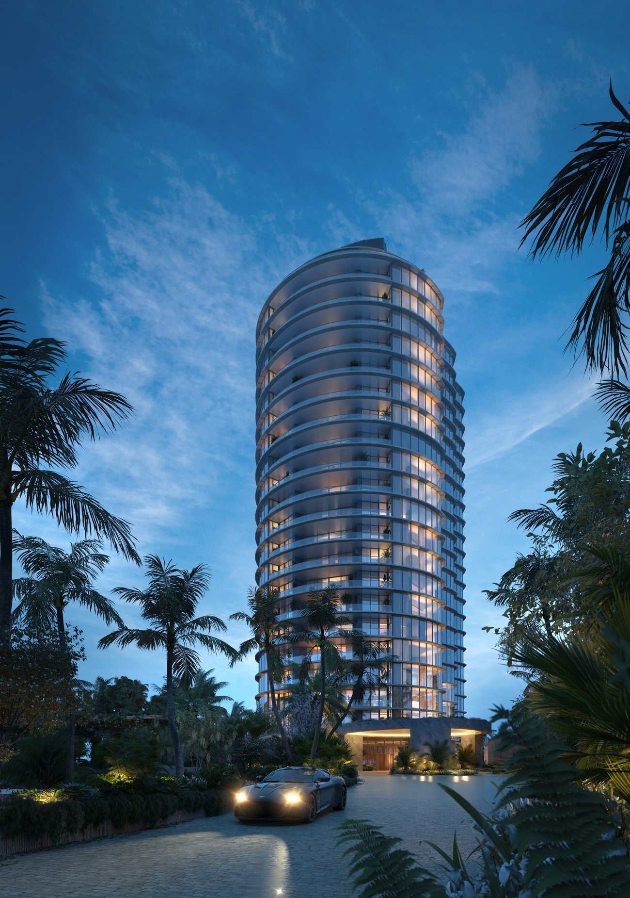 Rivage Bal Harbour lit at night from the entry drive — developer rendering