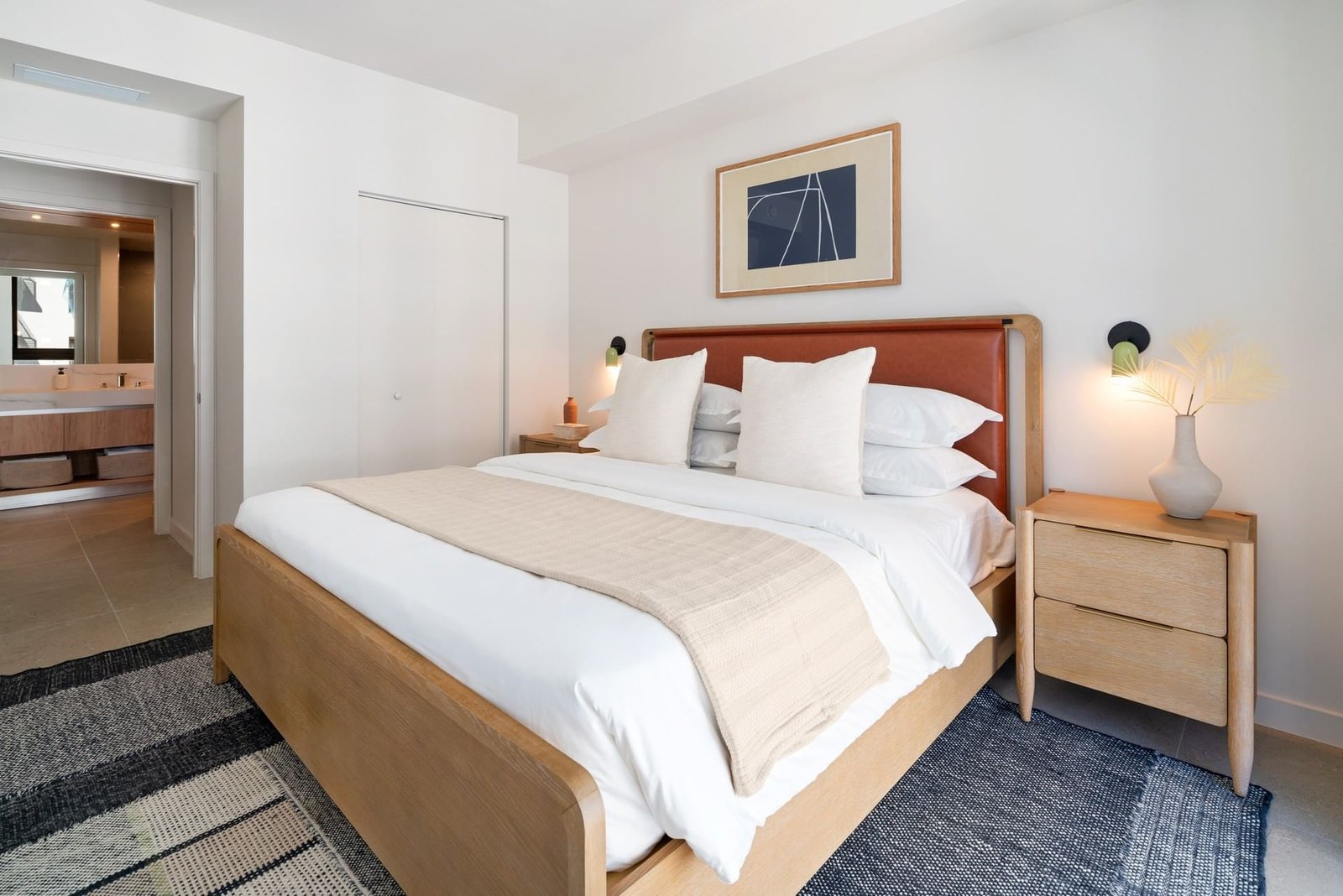 A residence bedroom at The Crosby, looking over downtown