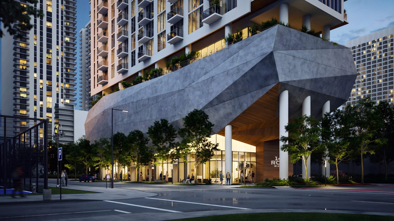 - 14 ROC Miami 14 ROC Miami, Arts & Entertainment District — marquesina de entrada a nivel de calle y acristalamiento del vestíbulo al anochecer, render del desarrollador