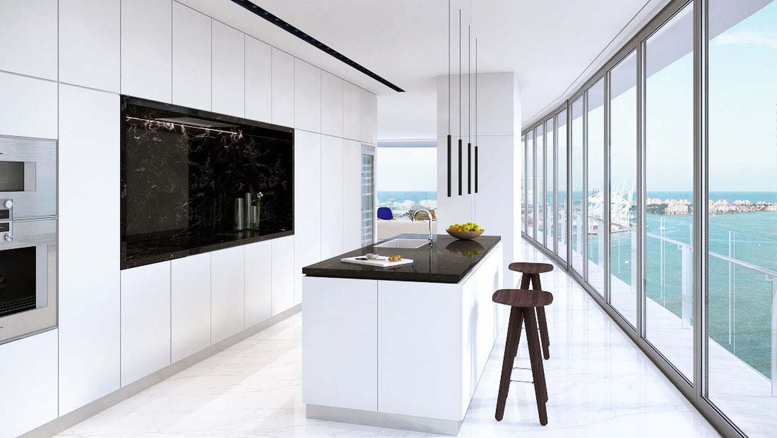 A galley kitchen with a dark stone island running along the window wall — developer rendering