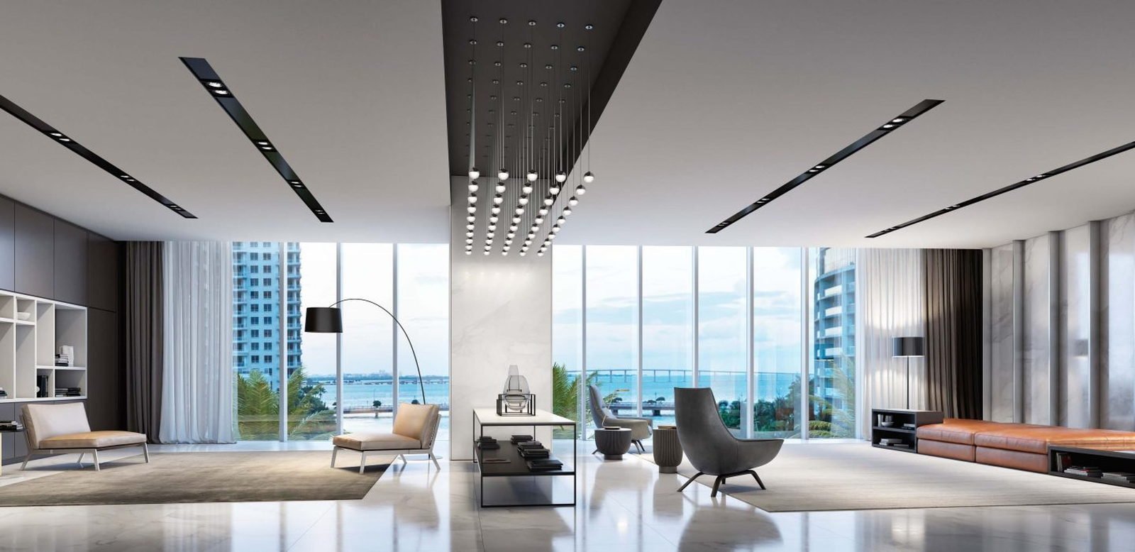 The tower lit at night and reflected in Biscayne Bay — developer rendering