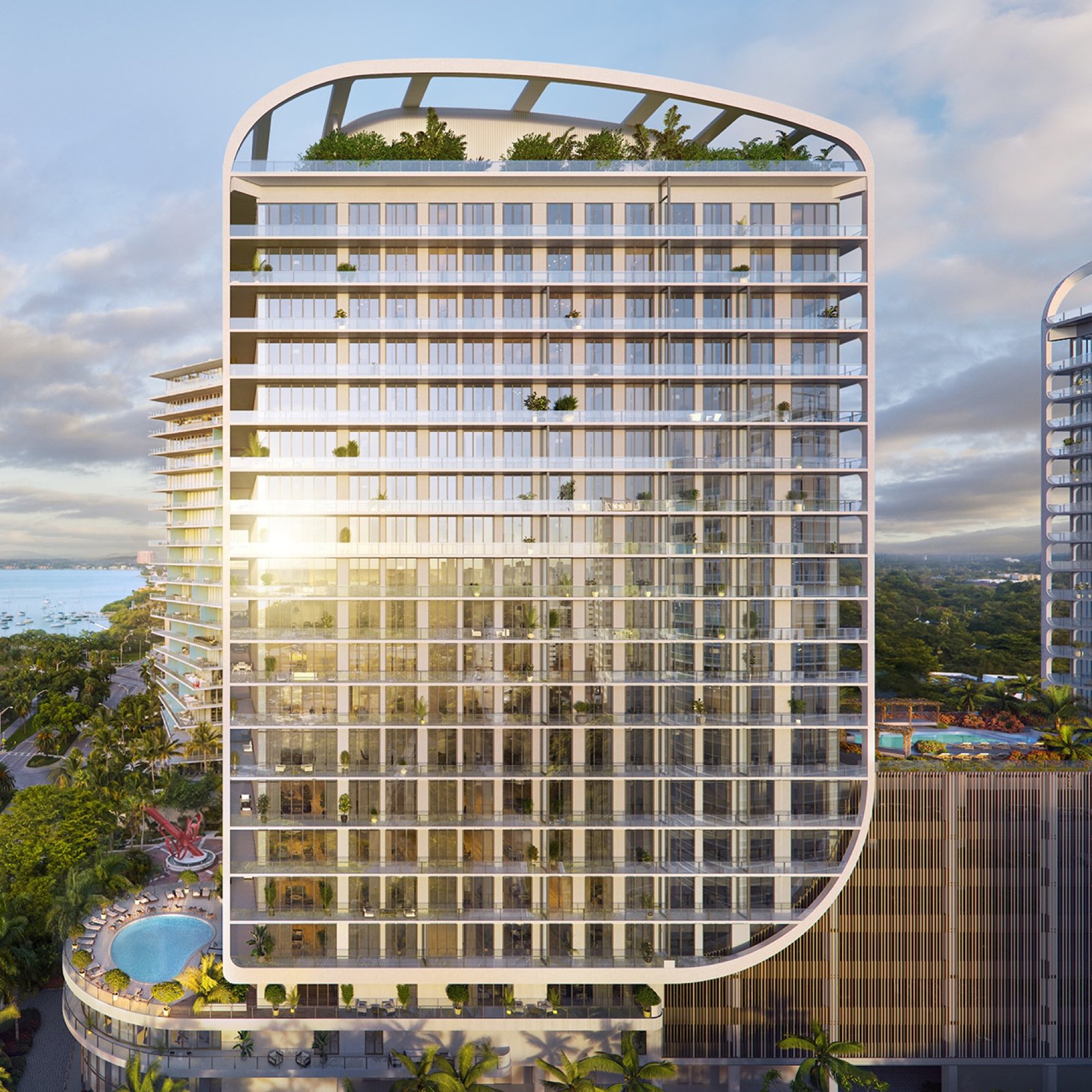 Mr. C Residences, Coconut Grove, Miami — full tower exterior with Biscayne Bay and skyline behind it