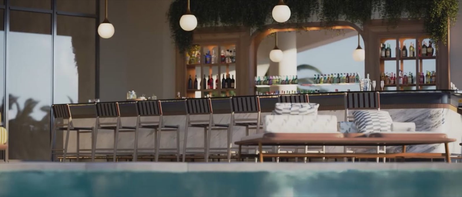 Mr. C Residences, Coconut Grove — poolside bar with marble counter, stocked shelving and outdoor seating