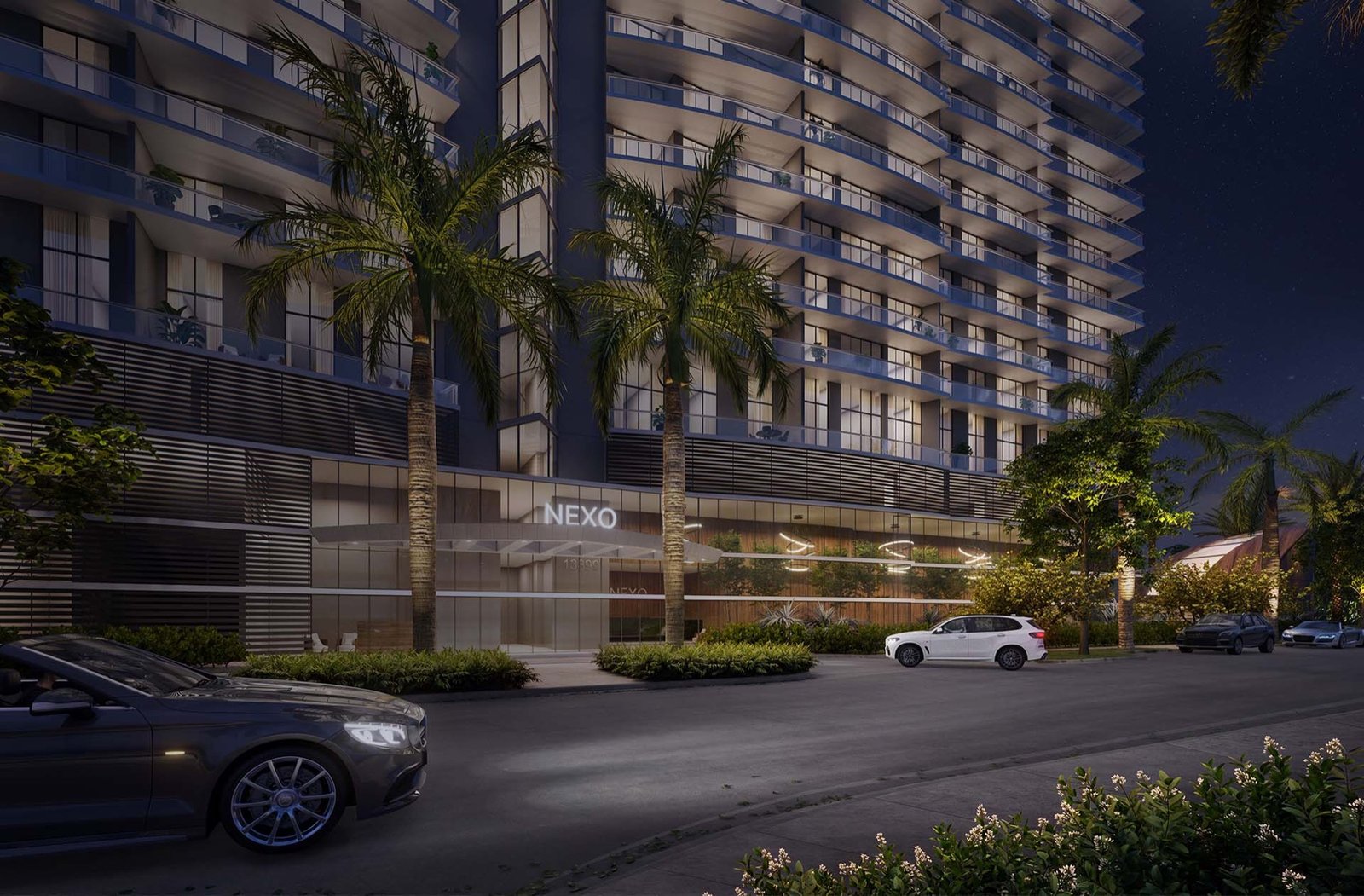 Nexo Residences, North Miami Beach — tower exterior at night with illuminated NEXO entrance sign, developer rendering