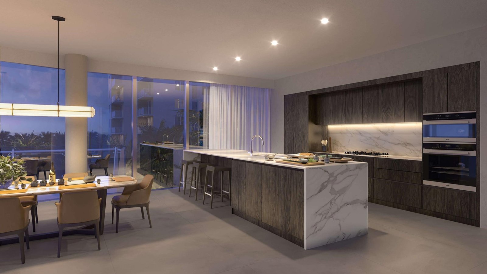 The Ritz-Carlton Residences, Pompano Beach — cocina y comedor de una residencia de la Torre Marina al anochecer
