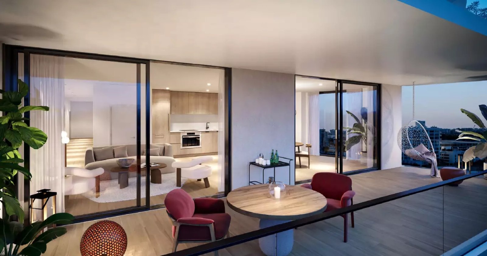 The Standard Residences, Midtown Miami — balcón y sala interior al anochecer, con vista a la ciudad, render del desarrollador