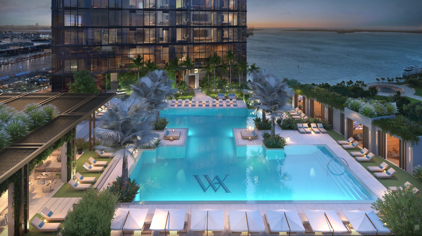 Waldorf Astoria Residences Miami — rooftop pool deck at dusk with bay view, developer rendering